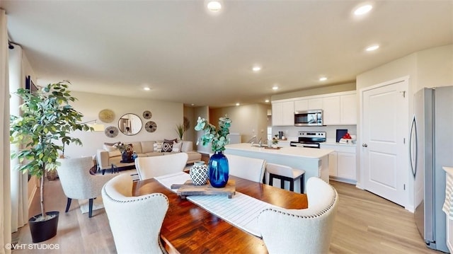 dining space featuring light hardwood / wood-style flooring