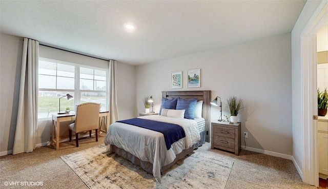 bedroom with light carpet