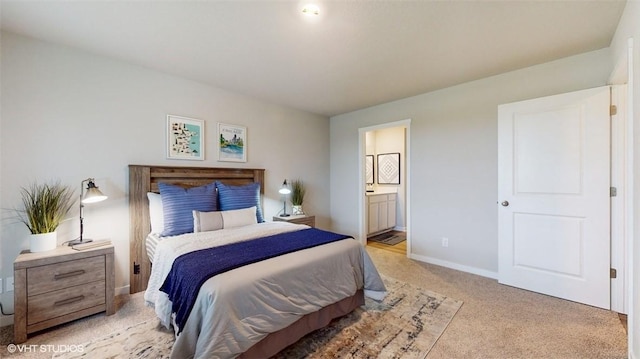 carpeted bedroom with connected bathroom