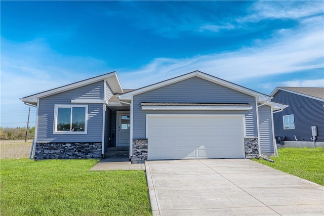 view of front of property with a garage and a front lawn