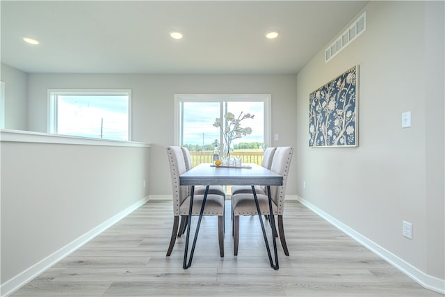 dining area featuring a healthy amount of sunlight and light wood-type flooring