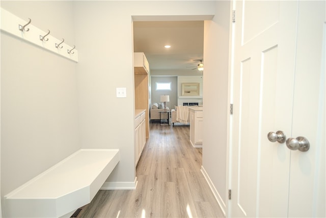 mudroom featuring ceiling fan and light hardwood / wood-style floors