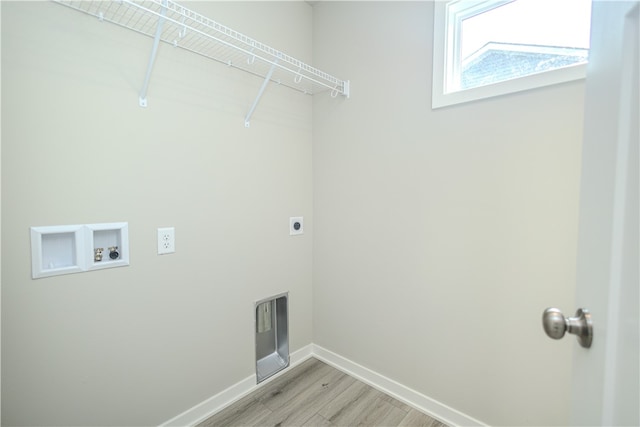 laundry area with light hardwood / wood-style floors, hookup for a washing machine, and hookup for an electric dryer