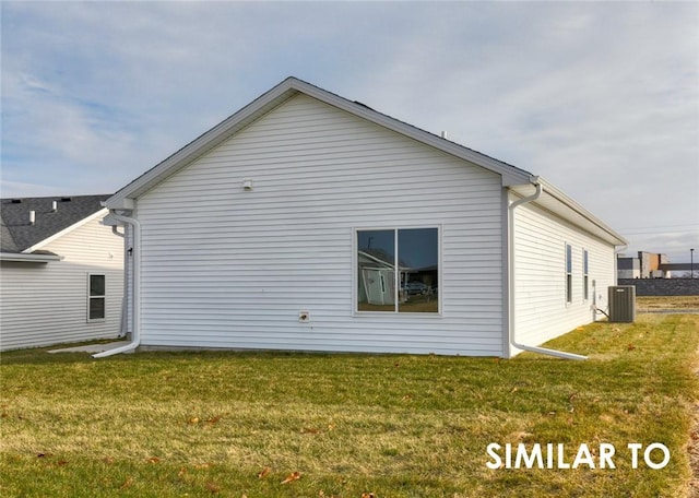 view of home's exterior featuring a lawn and central air condition unit