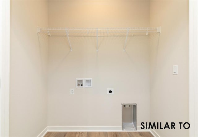 washroom featuring hardwood / wood-style flooring, washer hookup, and hookup for an electric dryer