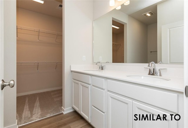 bathroom featuring vanity and hardwood / wood-style floors