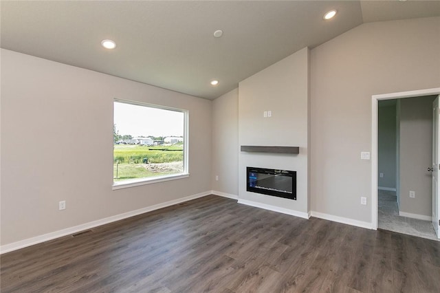 unfurnished living room with dark hardwood / wood-style flooring and lofted ceiling