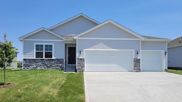 view of front of property with a front lawn and a garage