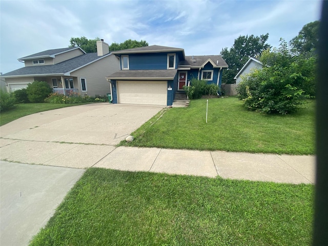 view of front of house with a garage and a front lawn