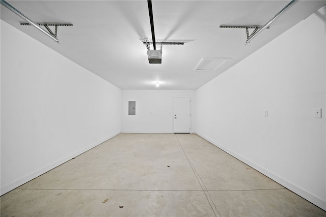 garage featuring electric panel and a garage door opener