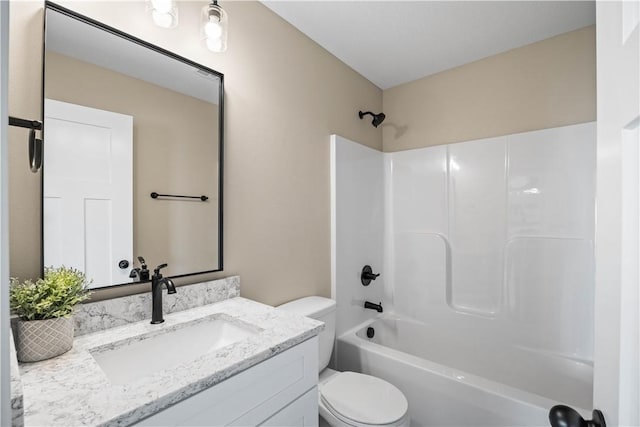 full bathroom with bathing tub / shower combination, toilet, and vanity