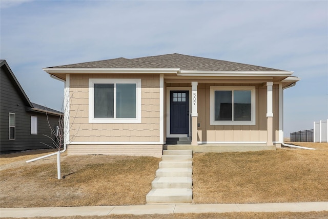 bungalow-style house featuring a shingled roof