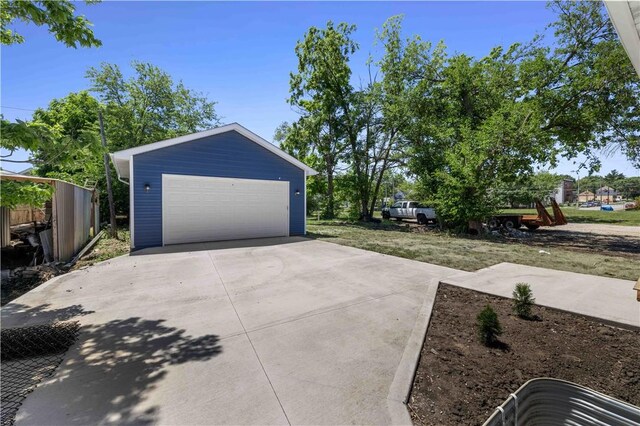 exterior space featuring a garage and an outdoor structure