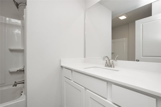 bathroom with shower / washtub combination and vanity