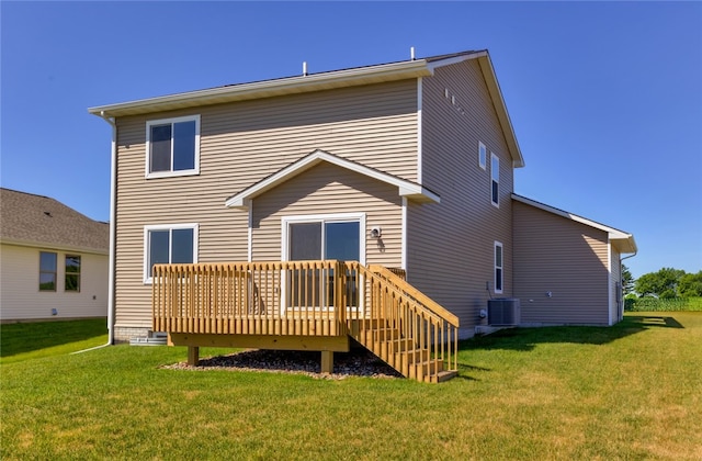 back of property with a lawn, cooling unit, and a deck