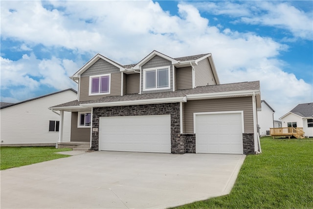 view of front of house with a front yard and a garage