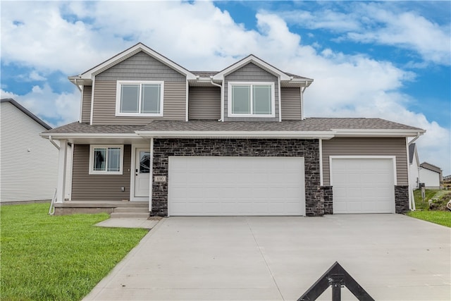 view of front of property featuring a garage and a front yard