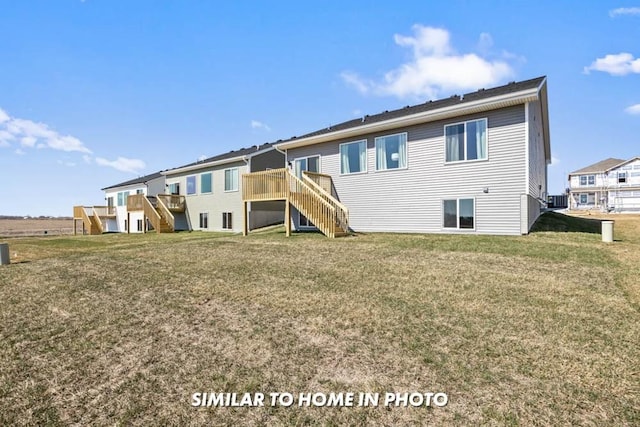 back of house with a lawn and a deck