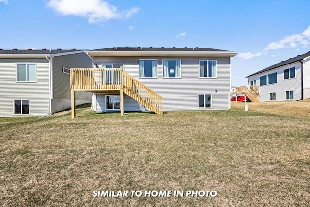 back of property featuring a wooden deck and a yard