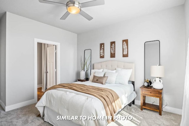 bedroom featuring light colored carpet and ceiling fan