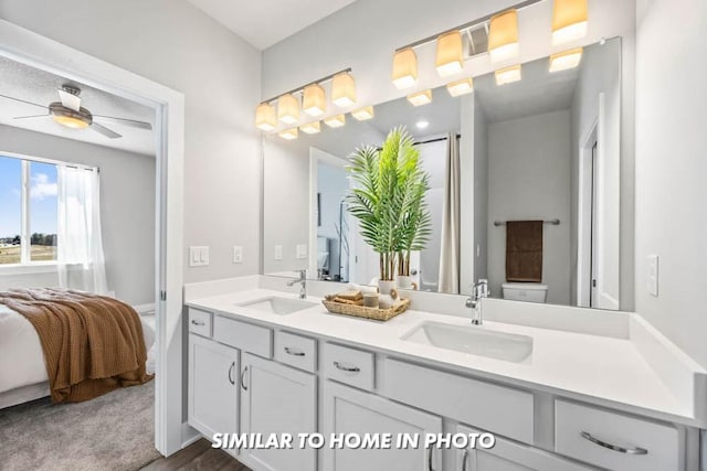 bathroom with vanity, ceiling fan, and toilet