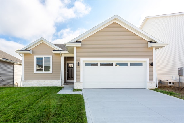 view of front of house with a garage and a front lawn