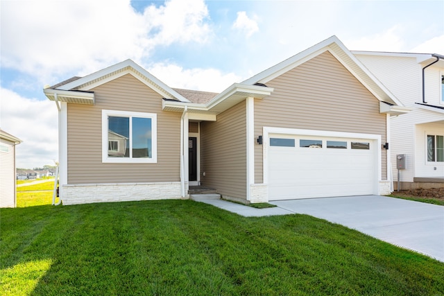 view of front of home with a garage and a front yard