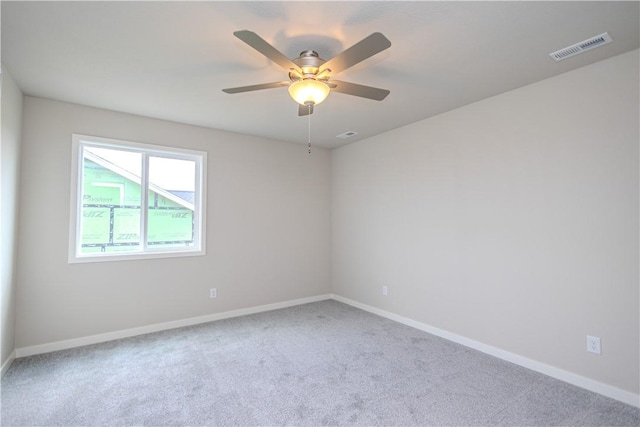 empty room with carpet floors and ceiling fan