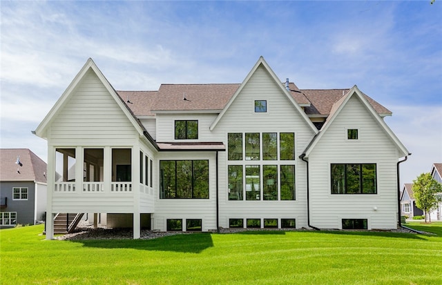 back of house featuring a yard