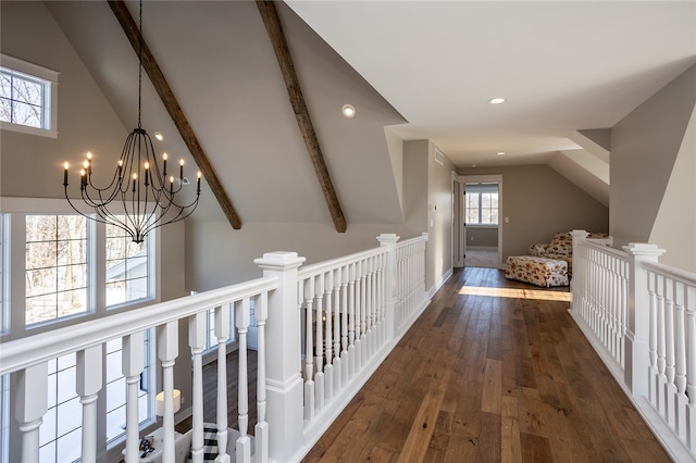 corridor featuring dark hardwood / wood-style floors, an inviting chandelier, and vaulted ceiling with beams