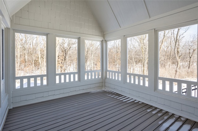 unfurnished sunroom featuring lofted ceiling