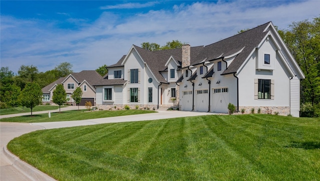 view of front of house featuring a front yard and a garage