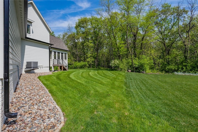 view of yard featuring central AC unit