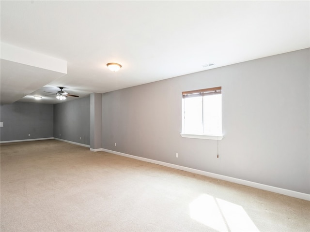 unfurnished room with ceiling fan and carpet floors