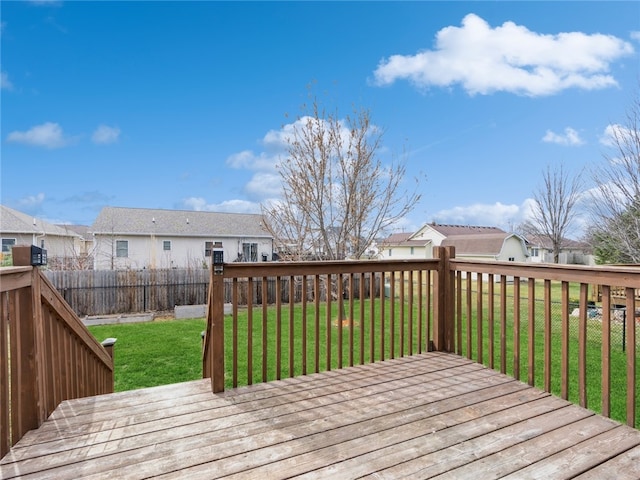 wooden terrace with a lawn