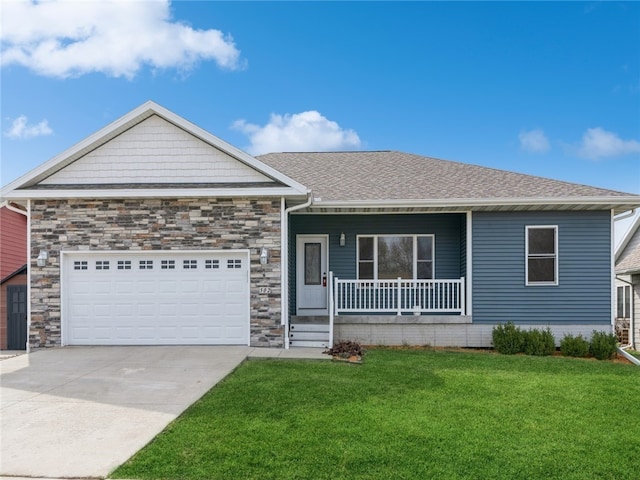 view of front facade with a garage and a front lawn