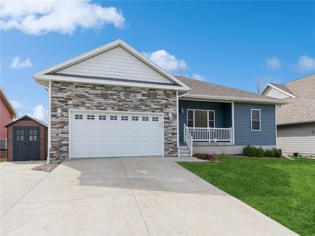 view of front of house featuring a garage and a front yard