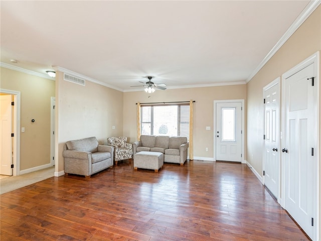 unfurnished living room with dark wood-type flooring, ceiling fan, and crown molding