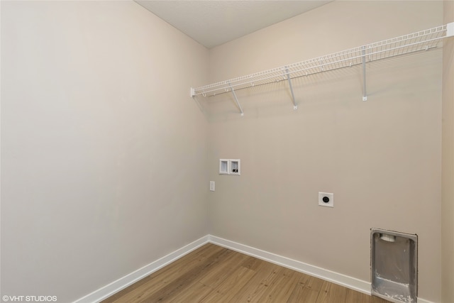 washroom featuring hookup for a washing machine, wood-type flooring, and hookup for an electric dryer