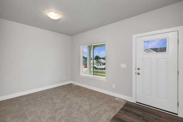 entrance foyer with a textured ceiling