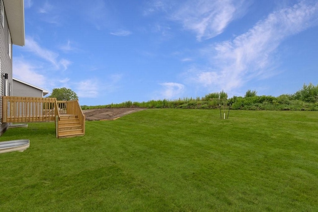 view of yard with a wooden deck