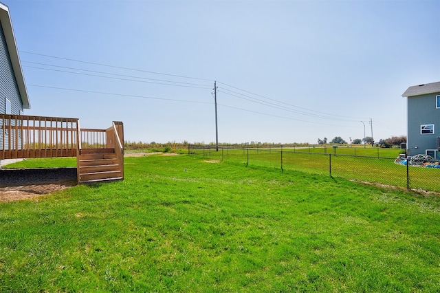 view of yard featuring a wooden deck