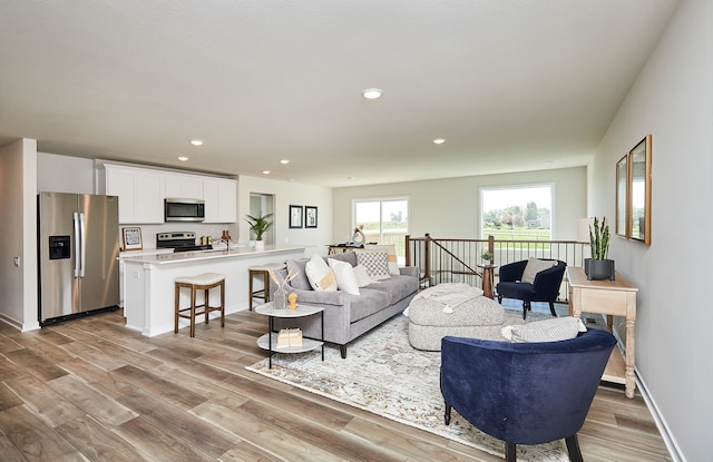 living room with light hardwood / wood-style floors