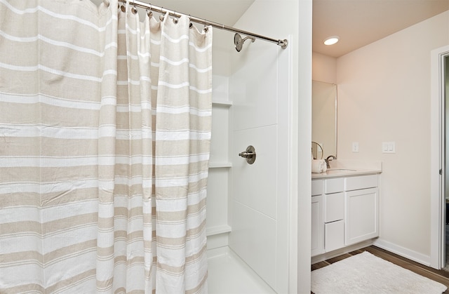 bathroom with vanity, hardwood / wood-style floors, and a shower with shower curtain