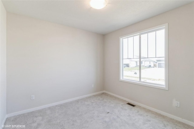 view of carpeted spare room