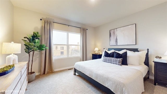 bedroom featuring light colored carpet