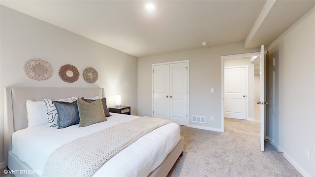 carpeted bedroom with a closet