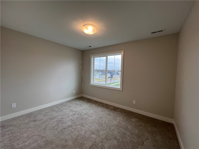 view of carpeted spare room