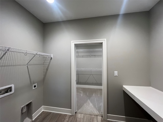 laundry area featuring hookup for a washing machine, hookup for an electric dryer, and dark hardwood / wood-style flooring