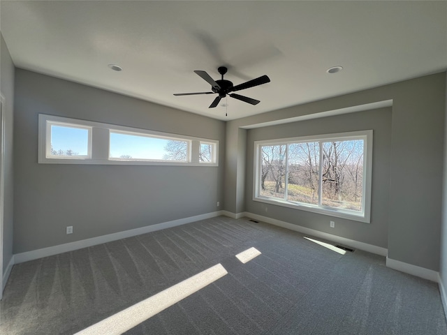 carpeted empty room with ceiling fan